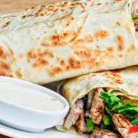 Chicken Shawarma Wrap · Thin slices of flame-broiled chicken.