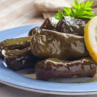 Dolmeh (6 Pieces) · Grape leaves stuffed with rice.