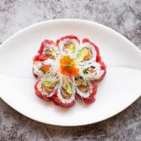 Sakura · Salmon, avocado, and cucumber wrapped with tuna topped with flying fish roe and special sauce.