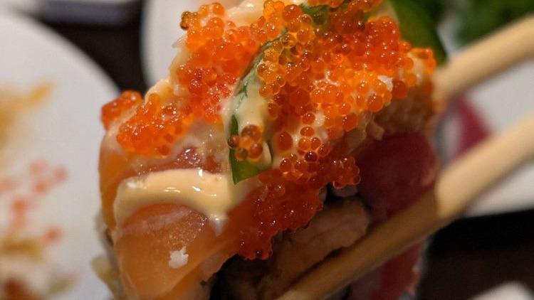 Flaming Dragon · In: Fresh water eel, salmon tempura, asparagus tempura
Out: Tuna, salmon, spicy crab meat, tobiko, thinly sliced jalapeno
Sauce: Unagi sauce, spicy mayo