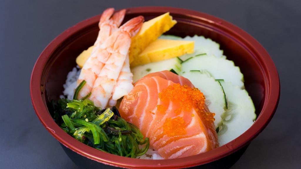 Poke Bowl · raw salmon mix sauce over rice with tamago cucumber tobiko seaweed salad green onion sesame (hawaii sauce)