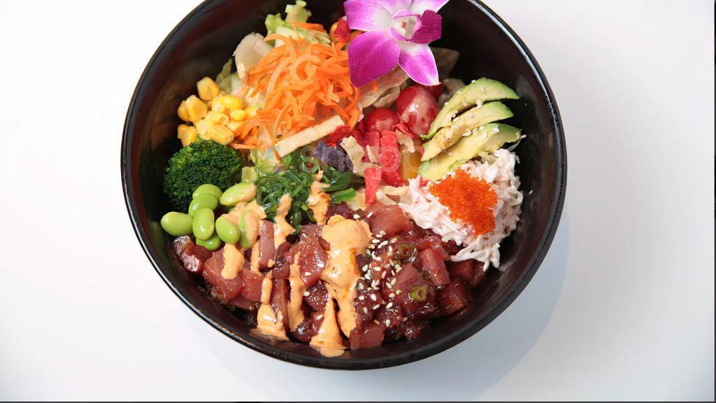 Ahi-Tuna Poke · serve sushi rice, imitation crab meat, corn, carrot, seaweed salad, avocado, cucumber, pita chips & tobiko