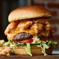 Volcano Burger · Beef burger, crispy shrimp, creamy Cajun sauce, Cheddar cheese, house-made pickles, aioli, l...