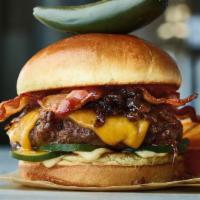 Bacon Bomb Burger · Beef burger, bacon onion jam, crispy bacon, Cheddar cheese, house-made pickles, aioli. Serve...