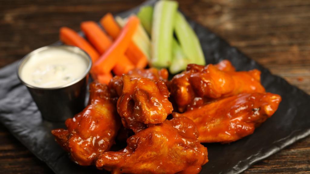 Classic Buffalo · 8 classic buffalo wings (medium heat), served with carrots & celery and a choice of blue cheese, classic ranch, or Sriracha ranch for dipping