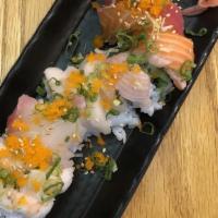 Sapporo Sam's · Inside: shrimp tempura, and avocado. Top: 5 types of fish and house sauce.