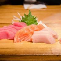 Sashimi Combo  · 12 pieces assorted raw fish (salmon, tuna, hamachi)