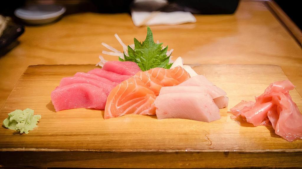 Sashimi Combo  · 12 pieces assorted raw fish (salmon, tuna, hamachi)