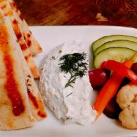 Tzatziki/Yogurt & Cucumber · Served with house made grilled pita, cucumber and pickles.