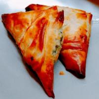 Spanakotiropita · Traditional filo pies of spinach, feta cheese, leeks & dill.