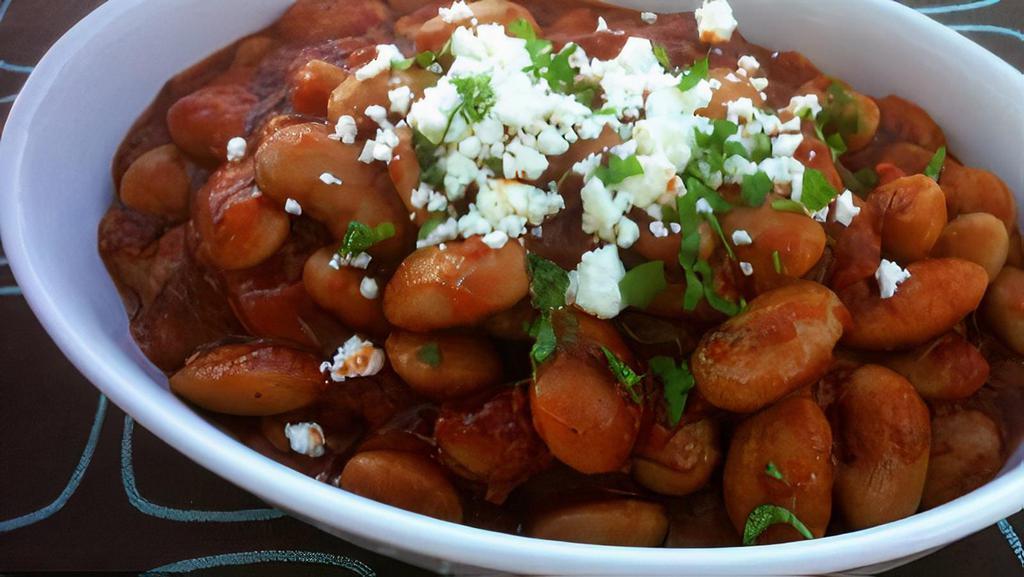 Gigantes/Giant Beans · Oven-baked giant beans with tomato sauce, olive oil, and herbed feta.