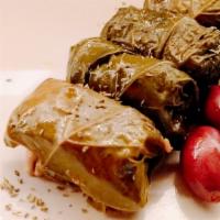 Dolmathes · Grape leaves stuffed with rice, mint, dill, lemon, and olive oil.