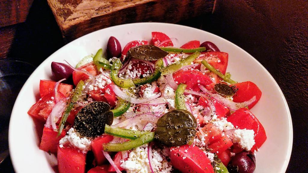 Hioriatiki Entree/Entree Greek Salad · Classic Greek salad of tomato, cucumber, bell pepper, onion, oregano, olives & feta cheese with Greek olive oil & red wine vinaigrette