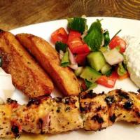 Kotopoulo Souvlaki/Chicken Souvlaki · Chicken breast grilled with onion, bell pepper, cucumber salad tzatziki, and potatoes.