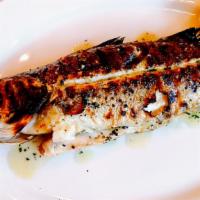 Psari Psito/Whole Fish · Grilled whole fish with lemon-oregano vinaigrette and horta.