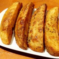 Kokkari Potatoes · Crisp baked then fried potatoes with lemon & oregano