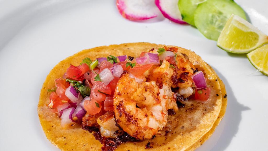 Camaron Taco · Corn tortilla, shrimp, and pico de gallo. Complimentary garnish: radish, cucumber, lime, and salsa.