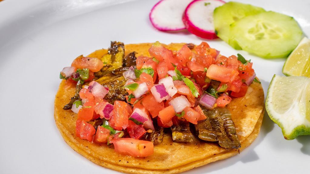 Nopal Taco (Veggie Option) · Corn tortilla, cactus, and pico de gallo. Complimentary garnish: radish, cucumber, lime, and salsa.