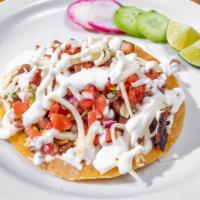 Super Taco · Corn tortillas, queso fundido, cheese, pinto beans, pico de gallo, sour cream, and your choi...