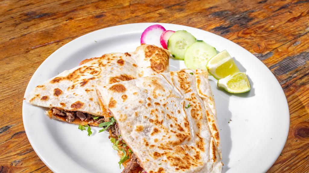 Quesadilla · Flour tortilla, cheese, cilantro, onions, and your choice of protein. Complimentary garnish: radish, cucumber, lime, and salsa.