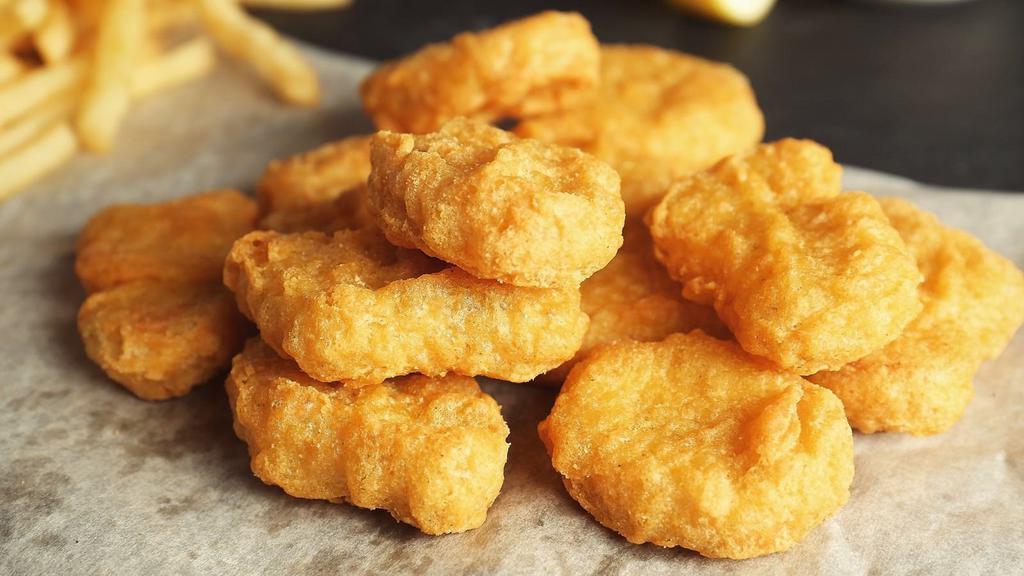 Chicken Nuggets · Eight pieces of crispy golden chicken nuggets. Served with french fries and a choice of sauce.