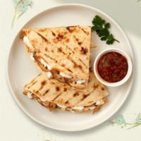 Just Kidding Quesadilla · Kid size quesadilla with cheese in a grilled tortilla.