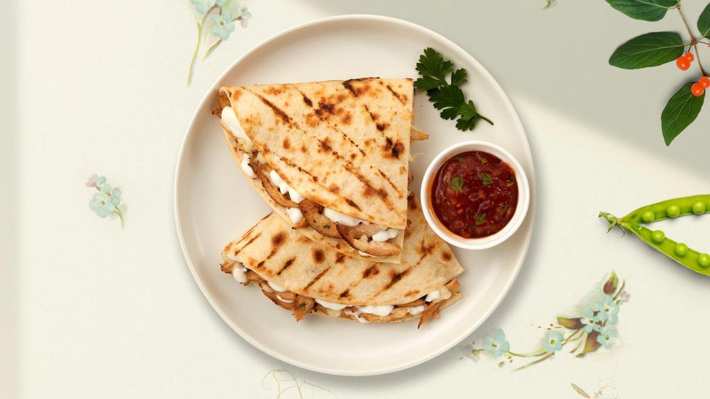Superman's Quesadilla · Super size quesadilla with your choice of protein wrapped with cheese in a grilled tortilla. Served with guacamole and sour cream.
