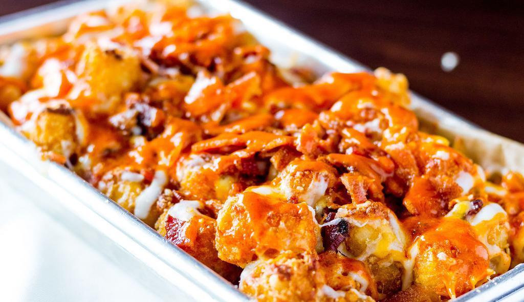 Disco Tots · Traditional sauce, melted cheese, chopped bacon.