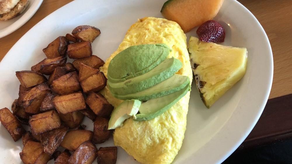 DUNGENESS CRAB OMELET · DUNGENESS CRAB , avocado, onions and Cheddar cheese.