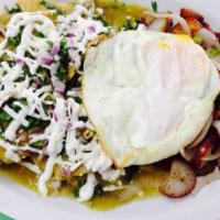 Chilaquiles · Crispy tortillas, Jack cheese, red onions, cilantro, sour cream, queso fresco, eggs any styl...