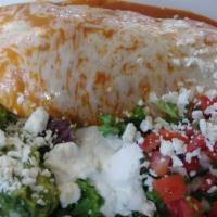 Wet Burrito · Spanish rice, choice of beans, guacamole, sour cream, lettuce, Jack cheese, pico de gallo, r...