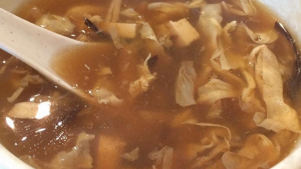 Chicken Hot & Sour Soup · A traditional Chinese soup with broth, eggs, tofu, chicken, and vegetables.