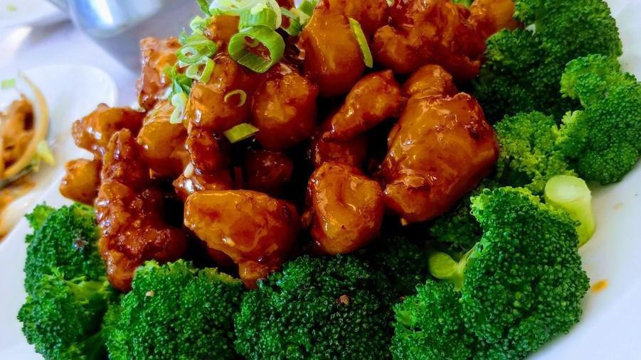 General Chicken · Fried white meat chicken, lightly battered, diced hot pepper, sweet and spicy sauce.