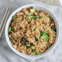Vegetable Fried Rice · White rice wok fried with diced vegetables, eggs, peas, carrots, and green onions.