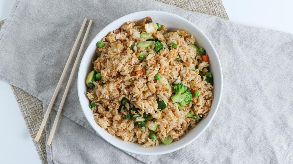 Vegetable Fried Rice · White rice wok fried with diced vegetables, eggs, peas, carrots, and green onions.