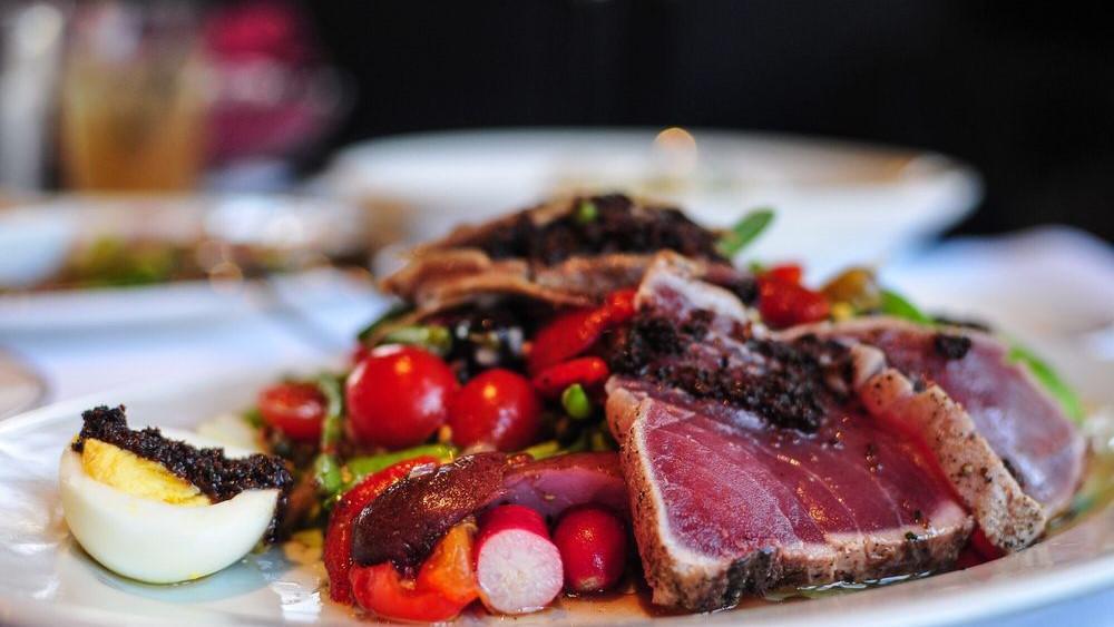 Niçoise Salade · seared Ahi, green beans, tomatoes, fingerling potatoes, tapenade, anchovy, roasted red bell peppers