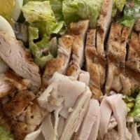 Cobb Salad · Mixed greens topped with charbroiled chicken, turkey, bacon, egg, avocado, tomato, and crumb...
