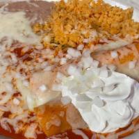 Friday - Two Crab Enchiladas · Crab filled enchiladas topped with red sauce, sour cream and onions. Served with rice,  and ...