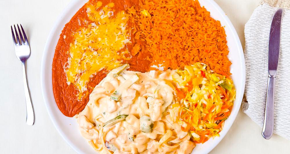 Pollo en Crema · Chunks of chicken breast sautéed with onions, bell peppers and spices with our secret sour cream sauce. Served with rice, beans, cole slaw.