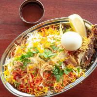 Hyderabadi Chicken Dum Biriyani · Aromatic basmati rice cooked with chicken. Served with raita.