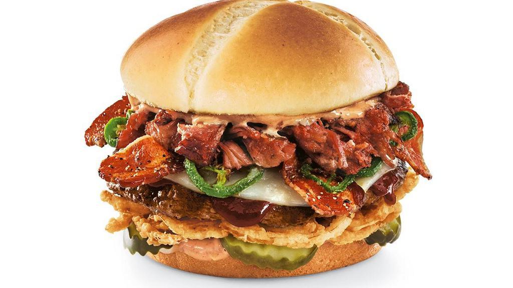 New! Smokehouse Brisket Burger · A fire-grilled beef burger topped with Whiskey River® BBQ Sauce, chopped smoked  brisket, black-peppered bacon, Provolone cheese, roasted jalapeños, dill pickle planks, onion straws and chipotle aioli on a toasted brioche bun.