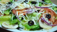 Vegetarian Salad · Romaine lettuce, tomatoes, red onions, black olives, artichoke hearts, mushrooms, bell peppers, and mozzarella.