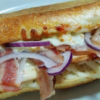 Chicken and Bacon Sandwich · Ranch sauce, sliced chicken breast, bacon, red onions, and mozzarella. With French roll.