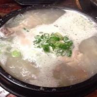 Ginseng Chicken Soup 삼계탕 · Ginseng stuffed whole young chicken stew with dates palms garlic & rice