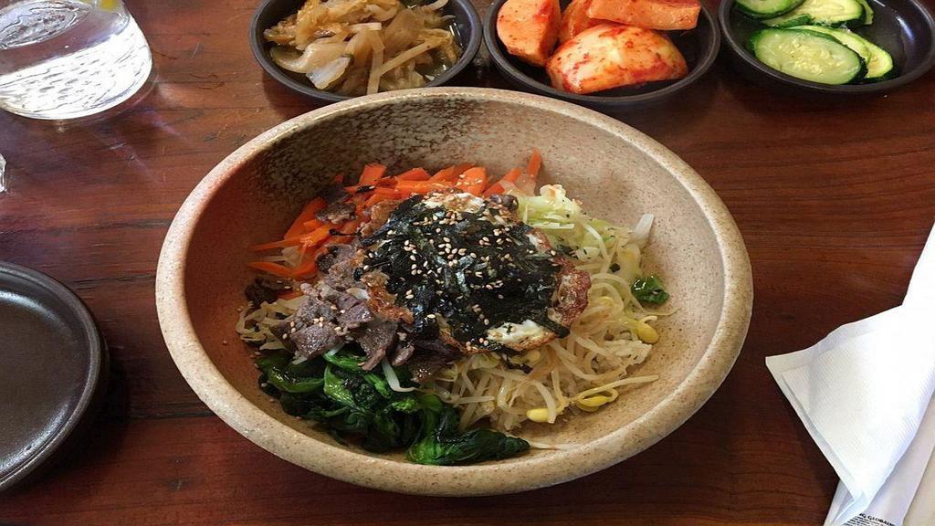 Bi Bim Bap 비빔밥 · Steamed mixed vegetables (carrot, bean sprouts, cabbage, spinach, and baby bean sprouts) and rice with an egg on top. Your choice of tofu or beef.