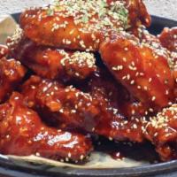 Yang Nyum Chicken 양념 치킨 · Fried Chicken w/ sweet &Korean chili Sauce. (Chicken Wings)