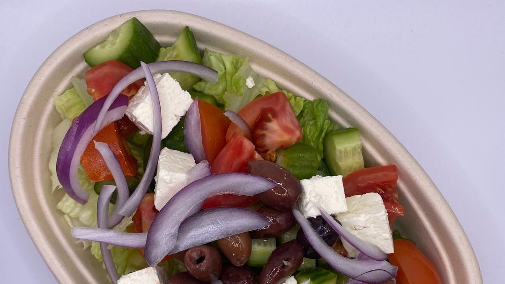 Greek Salad · Baby cucumber, onion, cherry tomato, pitted olives, feta cheese, romain, Lemon & Olive Oil