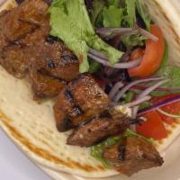 Beef Wrap · Beef shish, spring mix, cherry tomato, onion in the pita bread wrap, choice of side sauce, s...