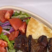 Beef Shish Plate · Specially marinated and grilled beef shish and salad, served with Rice or Roasted Veggies, c...