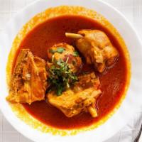 Achar Chicken · Chicken cooked in tomato base sauce with slightly tangy and spicy blend of spices.